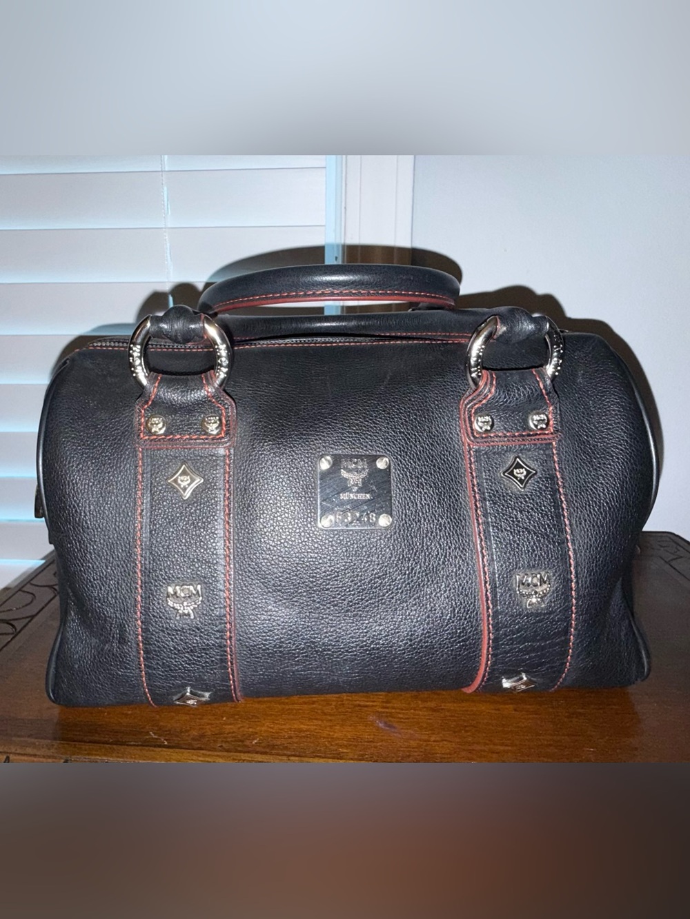 MCM Studded Logo Mini Boston Bag in Black Leather with Red Stitching